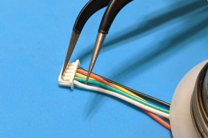 De-pinning a JST-PH cable connector with tweezers