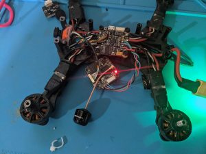 FPV drone on workbench with top off